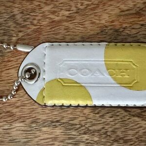 Coach White and Yellow Bag Tag
Medium (almost large but not largest)